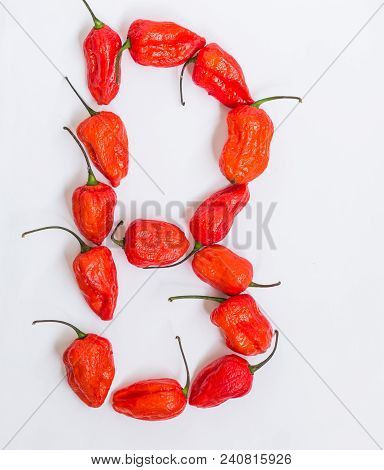 Letter Q Alphabet Made With Ghost Pepper Bhoot Jolokia Over White Background