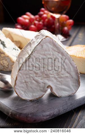 French Cheeses Plate In Assortment,  Neufchatel Heart Shaped Aged White Cow Cheese From Normandy