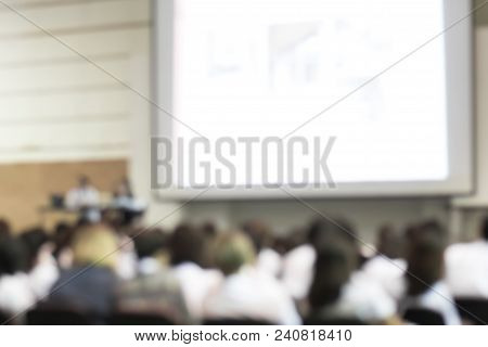 Blurred Abstract Background Of Business Or Educational Conference Seminar In Auditorium Hall