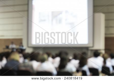 Blurred Abstract Background Of Business Or Educational Conference Seminar In Auditorium Hall