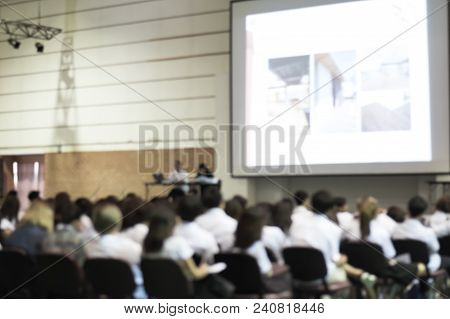 Blurred Abstract Background Of Business Or Educational Conference Seminar In Auditorium Hall