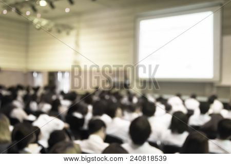 Blurred Abstract Background Of Business Or Educational Conference Seminar In Auditorium Hall