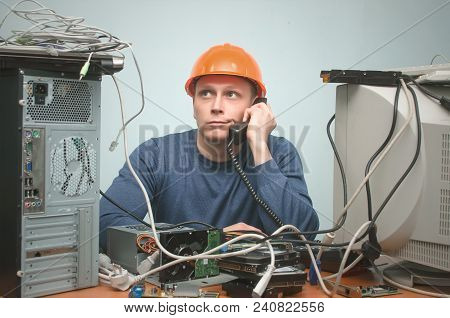 Tired Computer Technician Is Consulting A Users By Their Questions By ...