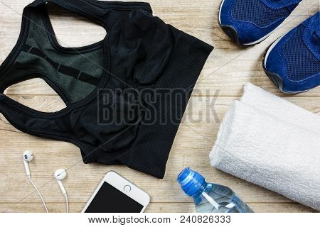 Fitness Activity Concept - Flat Lay Of Some Personal Sport Accessories For Woman On A Wooden Backgro