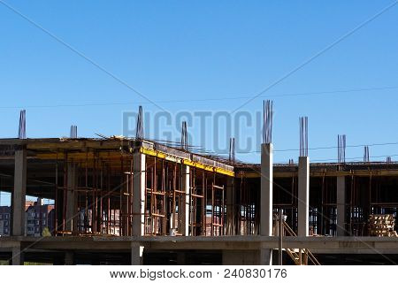 Lots Of Tower Construction Site With Cranes And Building With Blue Sky Background