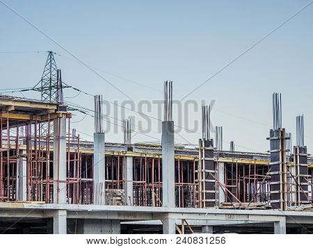 Lots Of Tower Construction Site With Cranes And Building With Blue Sky Background