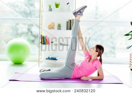Pretty Charming Strong Cute Lovely Slim Slender Flexible Woman Stretching And Warming Up Her Muscles