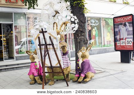 Lviv, Ukraine - July 08, 2017: Family Of Rabbits Toys Decoration Near Candy Shop Roshen On City Stre