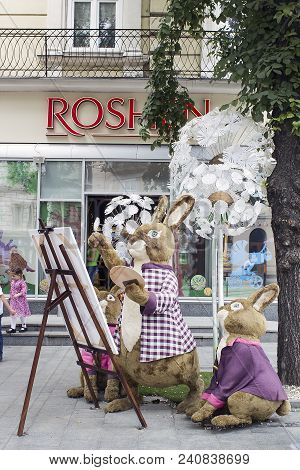 Lviv, Ukraine - July 08, 2017: Family Of Rabbits Toys Decoration Near Candy Shop Roshen On City Stre