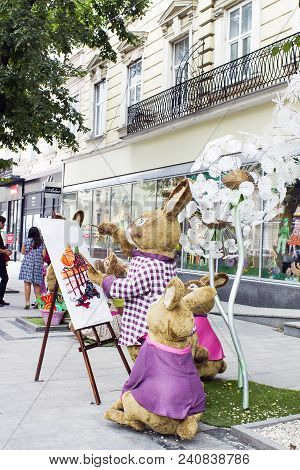 Lviv, Ukraine - July 08, 2017: Family Of Rabbits Toys Decoration Near Candy Shop Roshen On City Stre