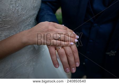 Bride And Groom Holding Hands Close Up