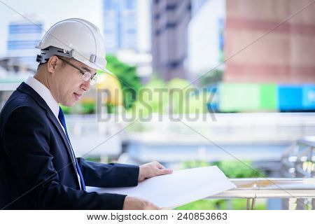 Asian Business And Engineer Man Has Planning And Working For Design Buiding And City.