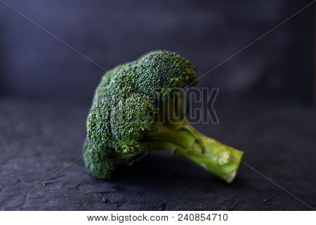 Fresh Brocoli On A Black Matte Background.