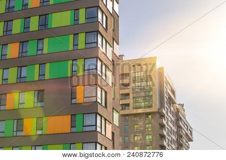 Facade Of The New Residential High-rise Buildings Against The Sky . The Concept Of Building A Typica