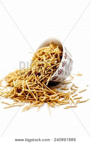 Popular Indian & Gujarati Dish Aloo Sev Or Potato Sev Or Mint Flavored Sev In A Bowl Isolated On Whi