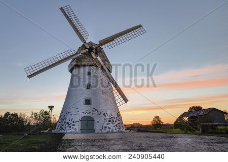 Traditional Old Dutch Windmill In Latvia. Sunrise View To Araisi Windmill In Vidzeme.