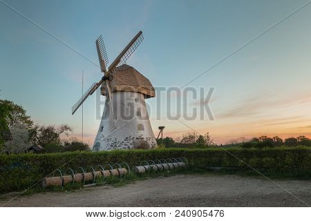 Traditional Old Dutch Windmill In Latvia. Sunrise View To Araisi Windmill In Vidzeme.