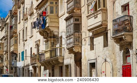 Ccolourful Balconies In The Ancient City Of Valletta, Malta. Valletta - Italian Word For Small Valle