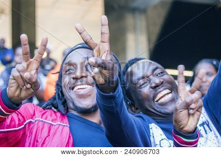 Cape Town, South Africa, 12 May 2018 - Diverse South African Football Supporters Cheering And Celebr
