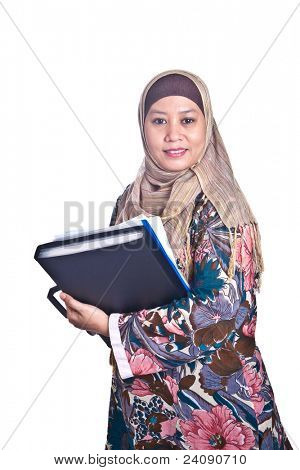 Beautiful liberated Muslim woman with books.