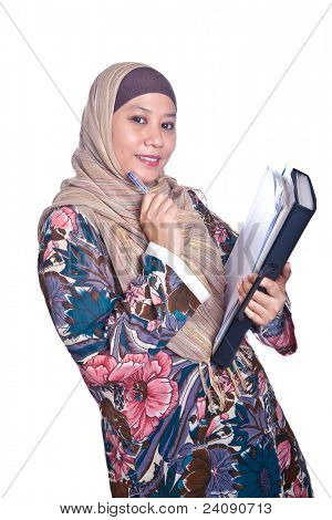 Beautiful liberated Muslim woman with books.