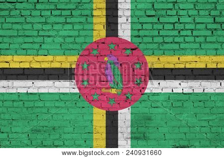 Dominica Flag Is Painted Onto An Old Brick Wall