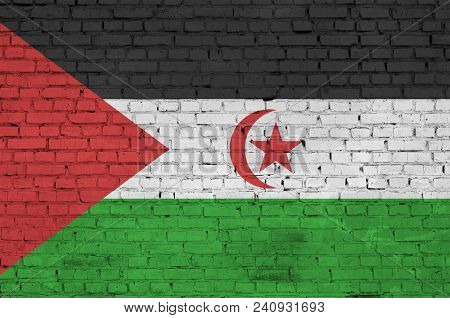 Western Sahara Flag Is Painted Onto An Old Brick Wall