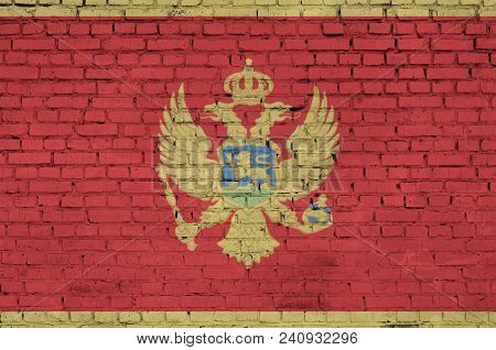 Montenegro Flag Is Painted Onto An Old Brick Wall
