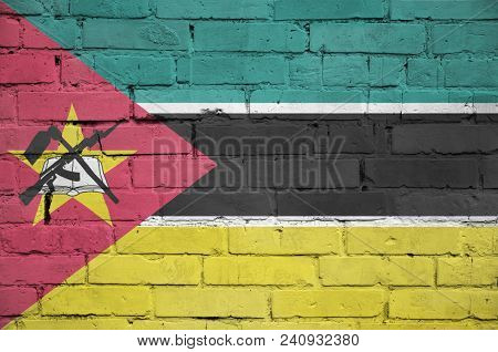 Mozambique Flag Is Painted Onto An Old Brick Wall