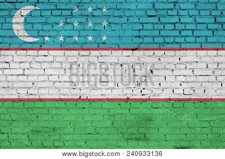 Uzbekistan Flag Is Painted Onto An Old Brick Wall