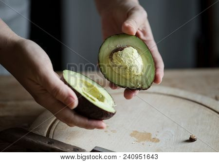 Organic avocado cut into halves food photography recipe idea