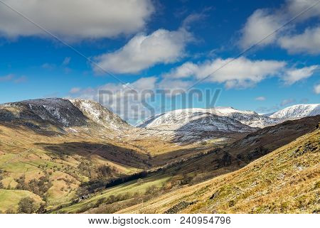 A View From Wansfell Pike Looking Towards The Kirkstone Pass With Snow On The Mountain Tops.