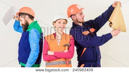 Men And Woman In Helmets Carefree With Hammer And Project, White Background. Insubordination Concept