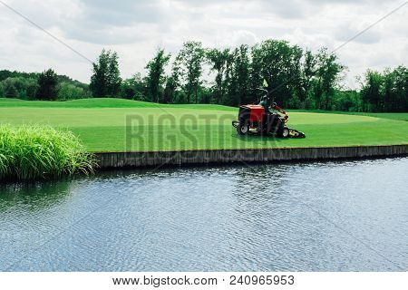 Golf Course Maintenance Worker, Cutting The Grass