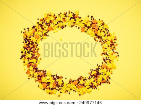 Colorful Nonpareil On Yellow Background. Top View