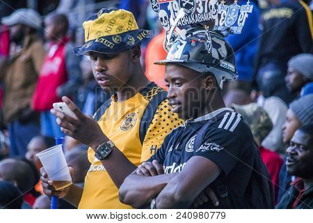 Cape Town, South Africa, 12 May 2018 - Diverse South African Football Supporters Checking Score On T