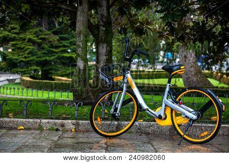 Rental Public Bike Parked On A Rainy Day