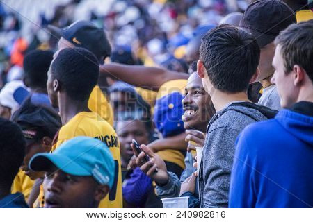 Cape Town, South Africa, 12 May 2018 - Diverse South African Football Supporters Cheering And Celebr