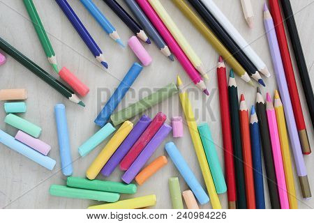 Pastel Crayons And Pencils On Woden Table. Artist Suply