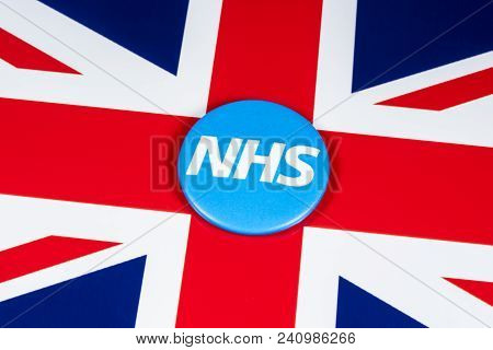 London, Uk - April 27th 2018: The National Health Service Symbol Over The Uk Flag, On 27th April 201