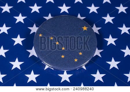 London, Uk - April 27th 2018: The Symbol Of The State Of Alaska, Pictured Over The Flag Of The Unite