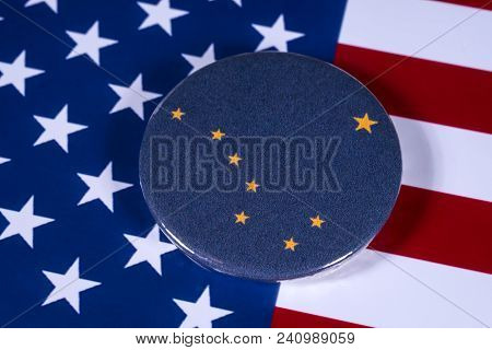 London, Uk - April 27th 2018: The Symbol Of The State Of Alaska, Pictured Over The Flag Of The Unite