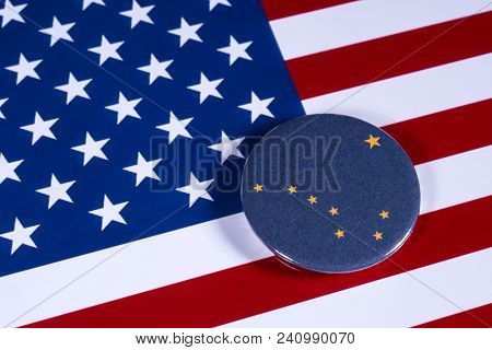 London, Uk - April 27th 2018: The Symbol Of The State Of Alaska, Pictured Over The Flag Of The Unite