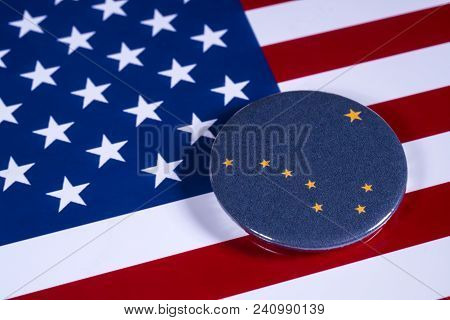London, Uk - April 27th 2018: The Symbol Of The State Of Alaska, Pictured Over The Flag Of The Unite