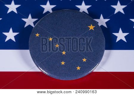 London, Uk - April 27th 2018: The Symbol Of The State Of Alaska, Pictured Over The Flag Of The Unite