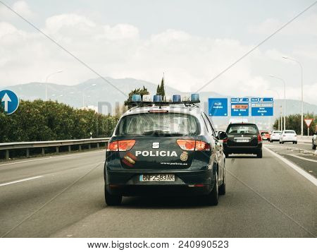 Palma De Mallorca, Spain - May 10, 2018: Drive Pov On The Police Policia Car Surveying The Highway O