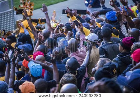 Cape Town, South Africa, 12 May 2018 - Diverse South African Football Supporters Cheering And Celebr