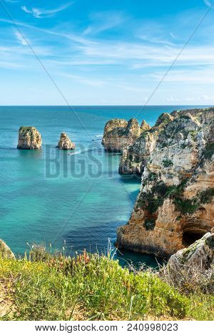 View To Lighthouse On Ponta Da Piedade In Lagos, Algarve, Portugal.