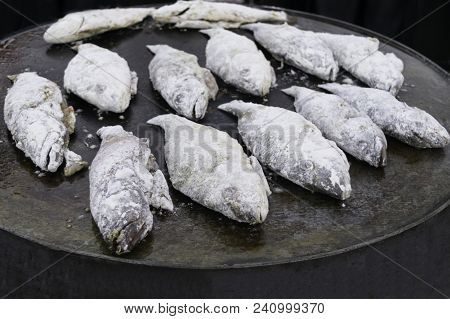 Cooking Fried Fish Smelt Rolled In Flour