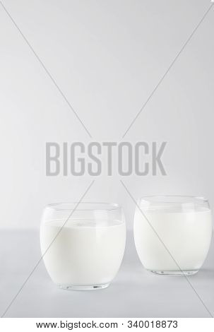 Organic Probiotic Milk Kefir Drink Or Yogurt In Two Glasses . Fermented Dairy Drink. Image With Copy